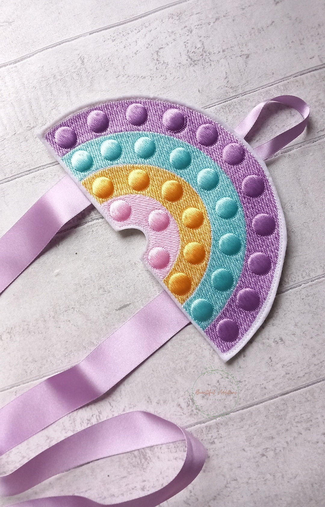 Feltie Popper Rainbow Bow Holder.