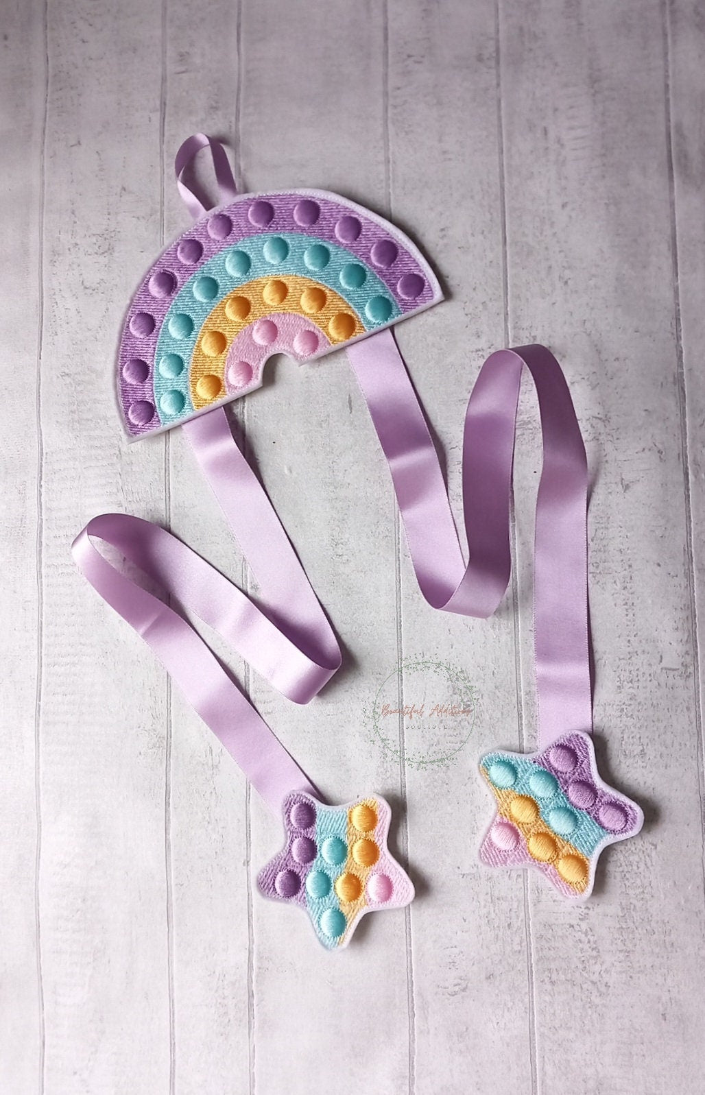 Feltie Popper Rainbow Bow Holder.