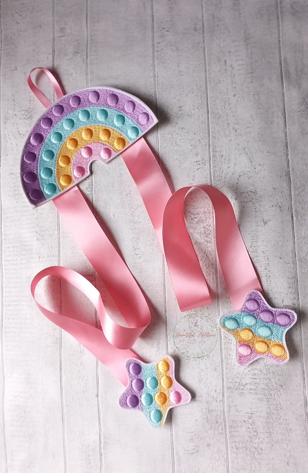 Feltie Popper Rainbow Bow Holder.